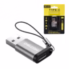 Adaptador USB C Hembra a USB A  Macho Delcom Conecta tus Cables USB C en Cualquier Puerto USB Pequeño adaptador Delcom DOTG USB de color plateado mostrando el conector USB A macho y el puerto USB C hembra con su cordón de seguridad de nylon producto de HD Multimedia