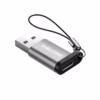 Adaptador USB C Hembra a USB A  Macho Delcom Conecta tus Cables USB C en Cualquier Puerto USB Pequeño adaptador Delcom DOTG USB de color plateado mostrando el conector USB A macho y el puerto USB C hembra con su cordón de seguridad de nylon producto de HD Multimedia