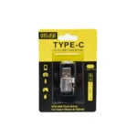 Adaptador USB-C Hembra a USB-A 3.0 Macho Delcom: ¡Conecta tus Cables USB-C en Cualquier Puerto USB!, Pequeño adaptador Delcom DOTG-USB3.0 de color plateado, mostrando el conector USB-A macho y el puerto USB-C hembra, con su cordón de seguridad de nylon, producto de HD Multimedia.