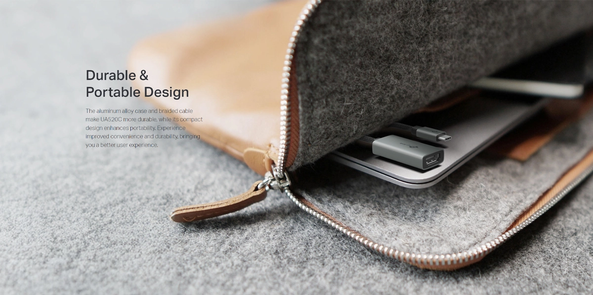 Adaptador USB-C a HDMI 4K@60Hz TP-Link UA520C: ¡Calidad de Imagen Superior y Confiabilidad!, Adaptador USB-C a HDMI TP-Link UA520C de color gris con carcasa de aluminio y cable enmallado negro, mostrando el conector USB-C y el puerto HDMI hembra, producto premium de HD Multimedia.