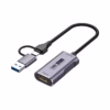 Capturadora HDMI 4K USB-C y USB 3.0 NETCOM PE-EL0285___01 Capturadora HDMI 4K USB-C y USB 3.0 NETCOM PE-EL0285: Eleva tus Transmisiones a Nivel Pro, Capturadora de video Netcom PE-EL0285 con carcasa de aluminio, mostrando su cable enmallado con conector USB-C y adaptador a USB-A, un producto de streaming profesional de HD Multimedia PERU SAC.