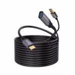 Extensión USB-C a USB-A 5MT Activo 5GBPS 60W NETCOM PE-EX0305: Extiende tu Conexión USB-C a 5 Metros sin Perder Velocidad, Cable extensor USB-C activo de 5 metros Netcom PE-EX0305, mostrando el conector de entrada USB-C y el extremo hembra USB-A con su conector de alimentación auxiliar, un producto de HD Multimedia PERU SAC.